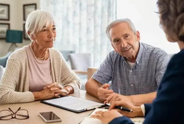Senior Care Facility - Senior Couple Talking With a Care Specialist